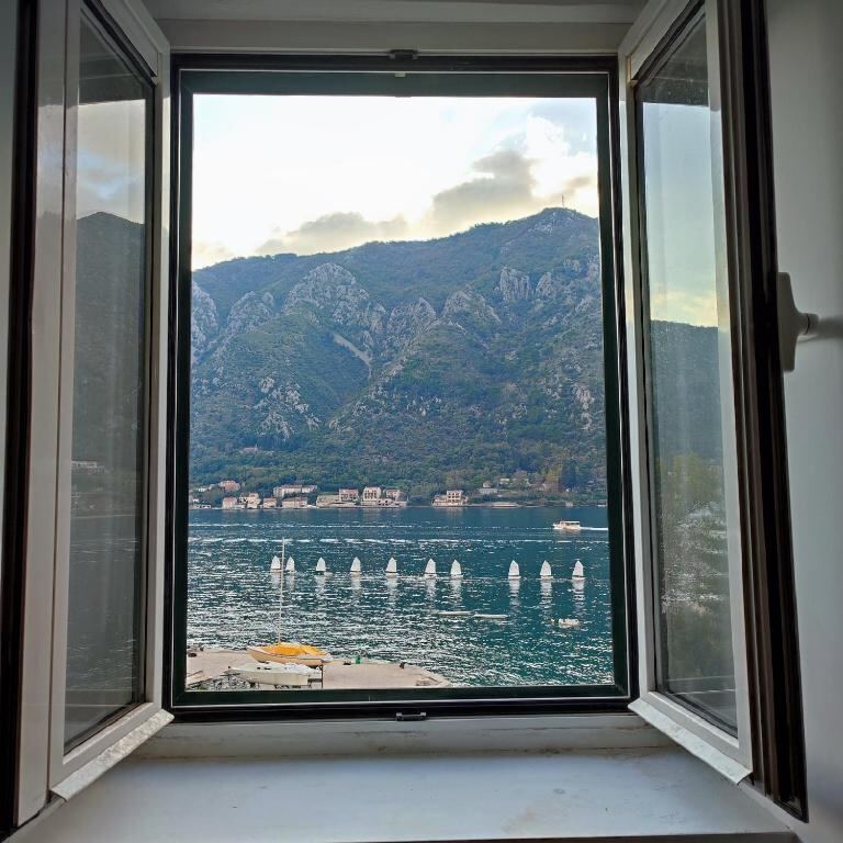 View of the Bay of Kotor and mountains from an apartment window at Villa Kamena
